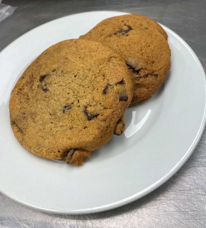 Two chocolate chip cookies on a plate